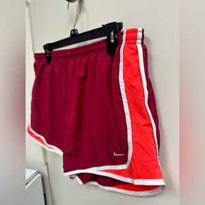 Nike running shorts size XL. Maroon with a vibrant orange/red color!
